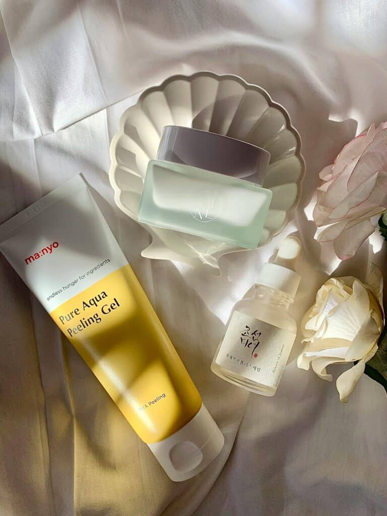 Best affordable face creams flatlay on neutral background for glowing skin 2026